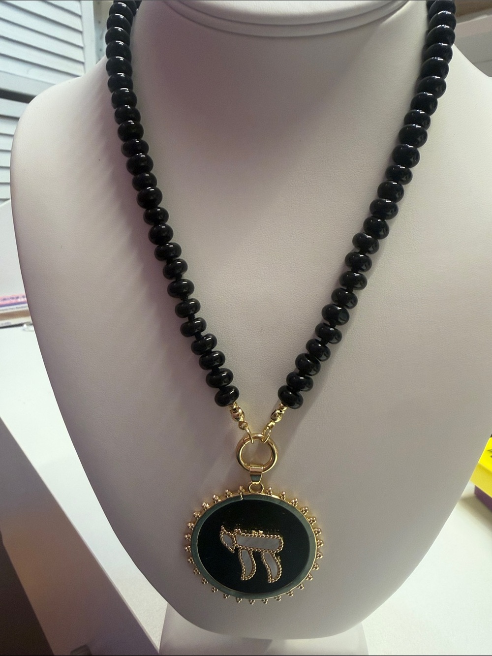 Black Beaded Necklace with Gold Pendant